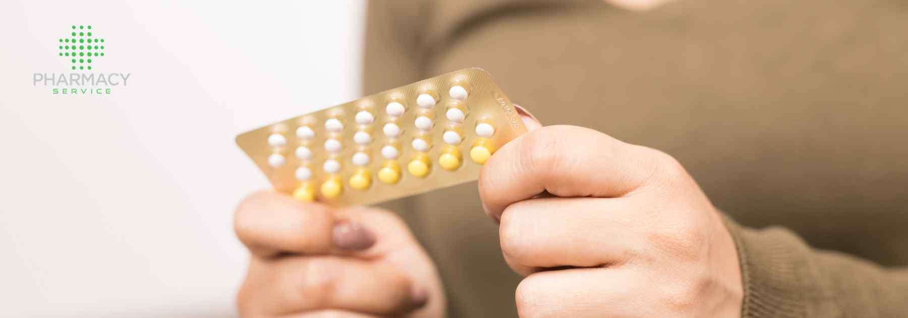 Woman holding a pack of contraceptive pills