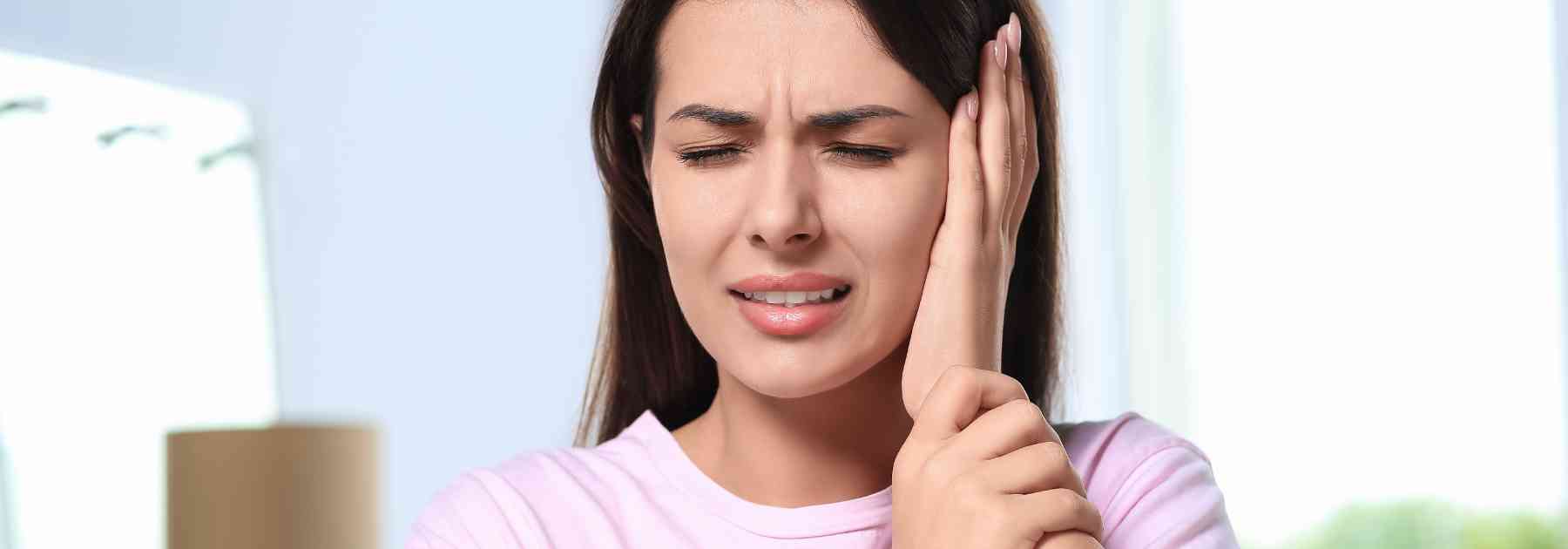 why does my ear feel blocked on one side?